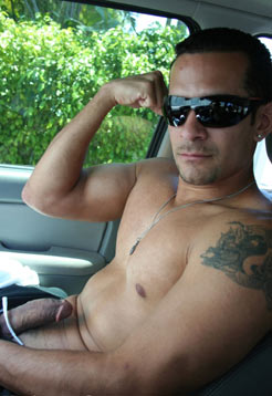 Armando showing his biseps and starting to get hard in his car